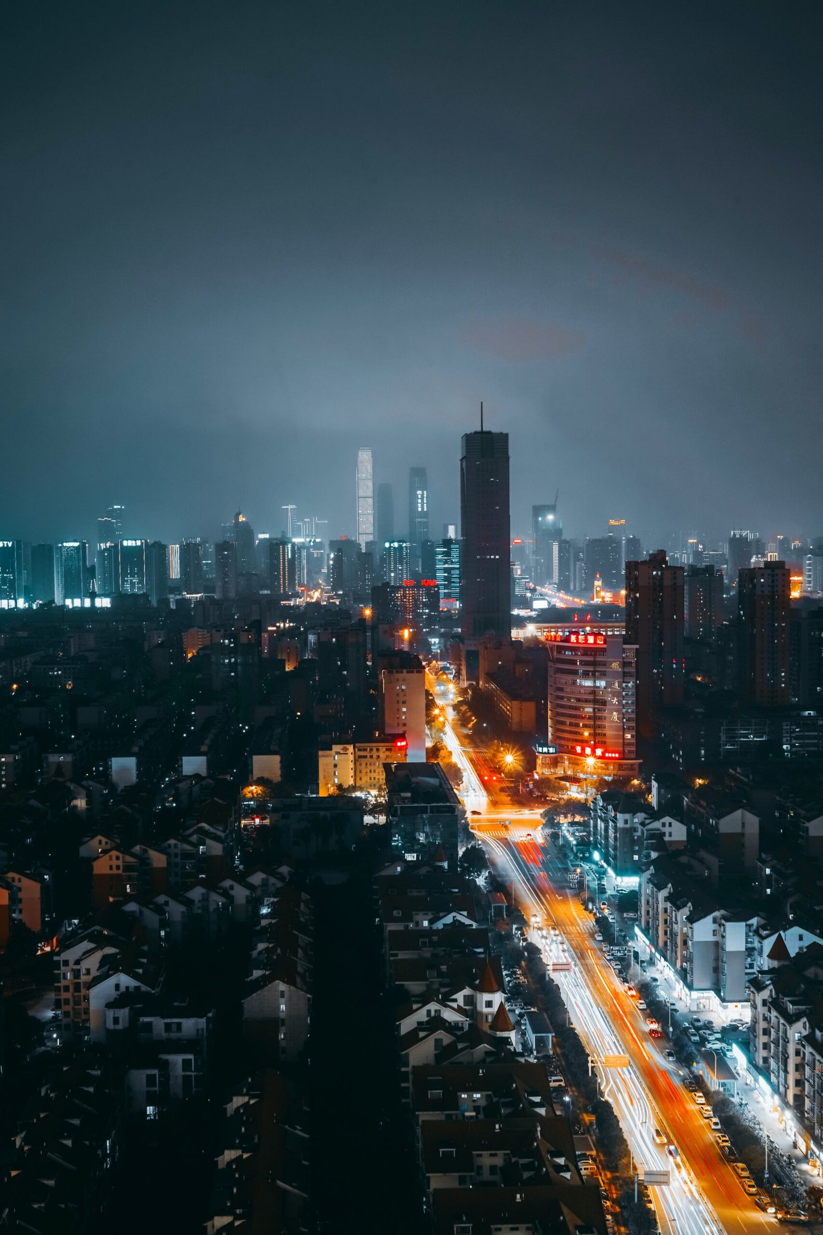 city with high rise buildings during night time